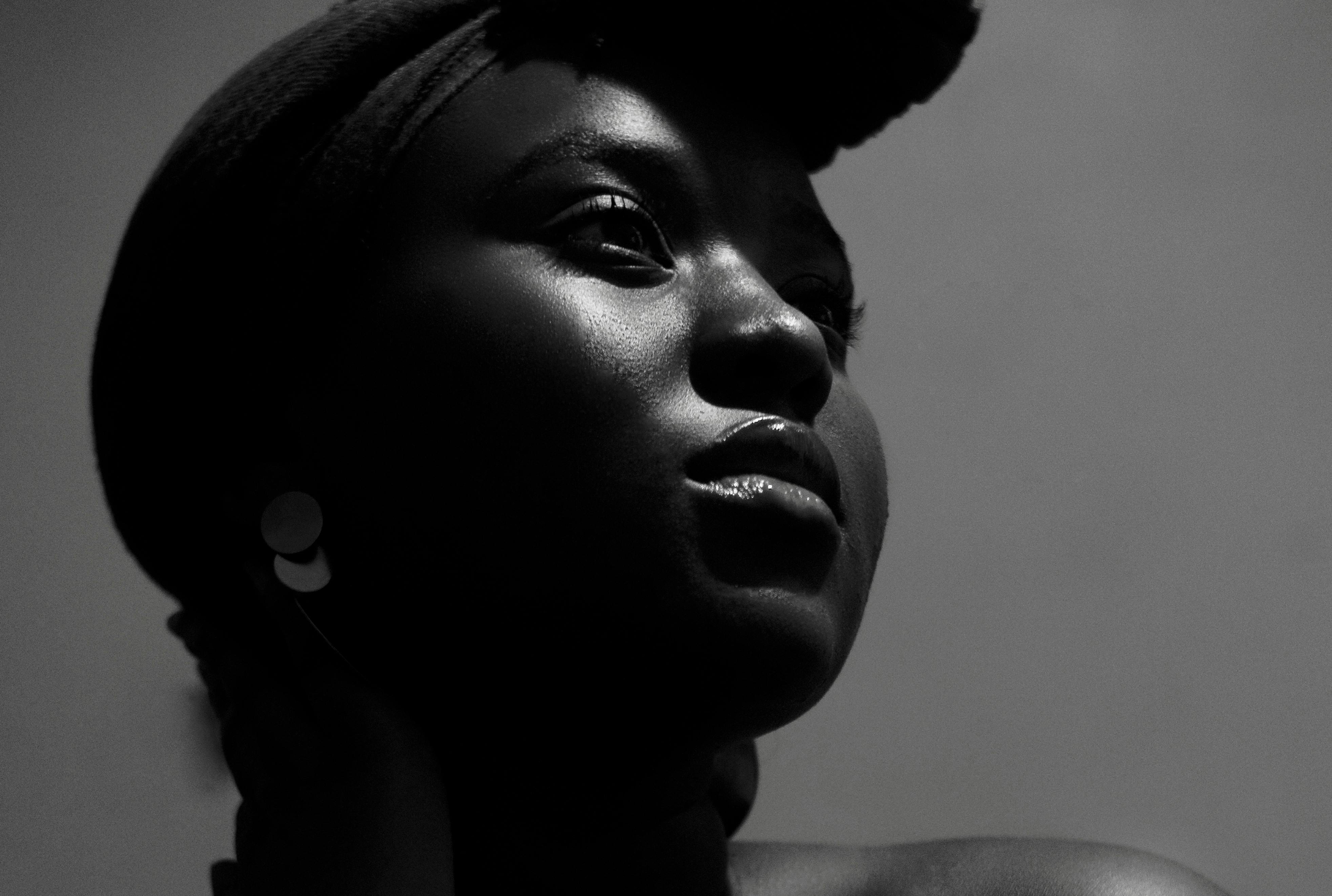Naelle Studio Desktop- Mental Wellbeing - Black Woman with head war looking into the distance