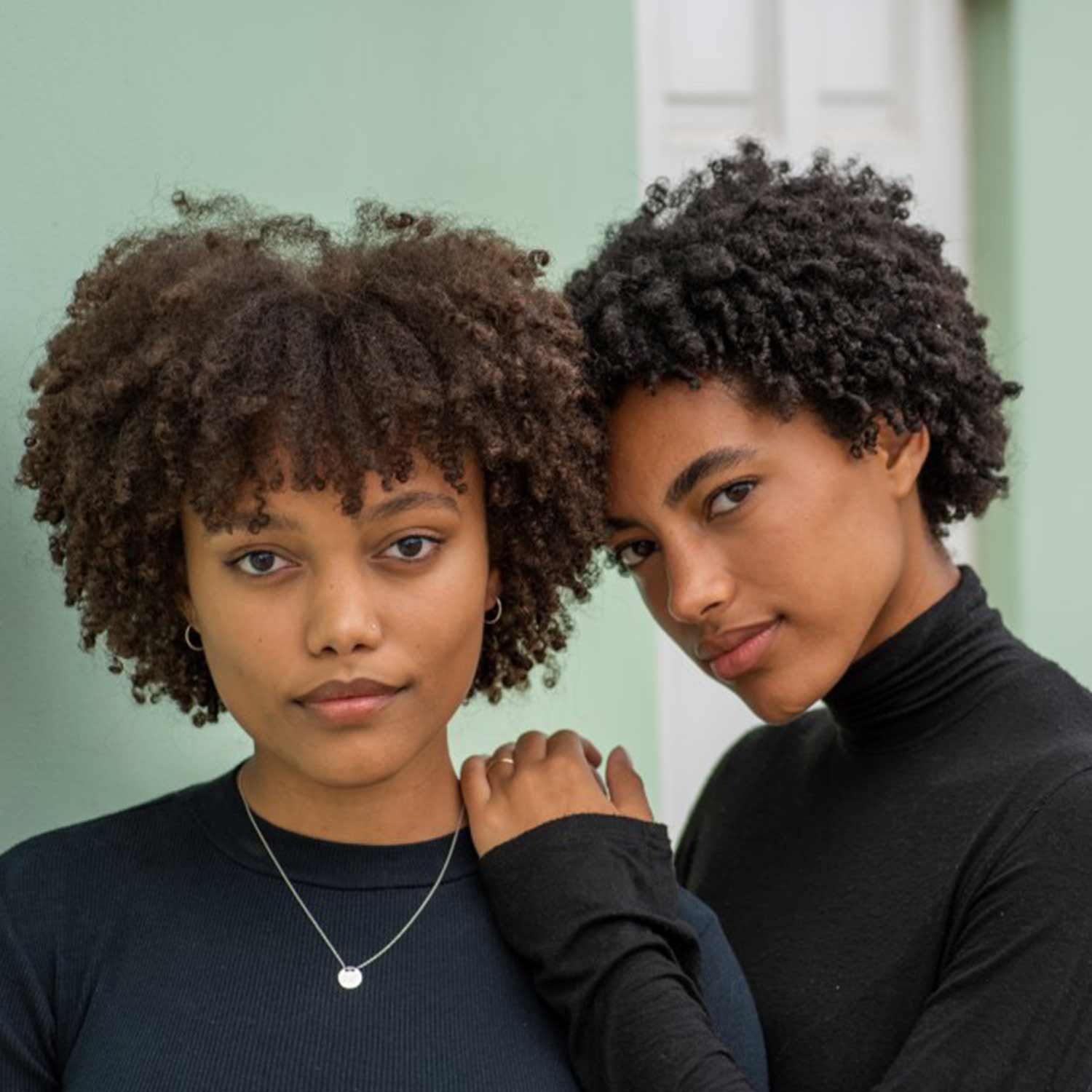 Naelle Studio - Two Black women with curly afros